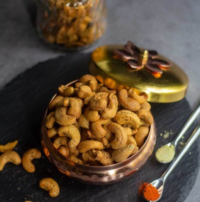 square image of roasted cashews in a gift bowl