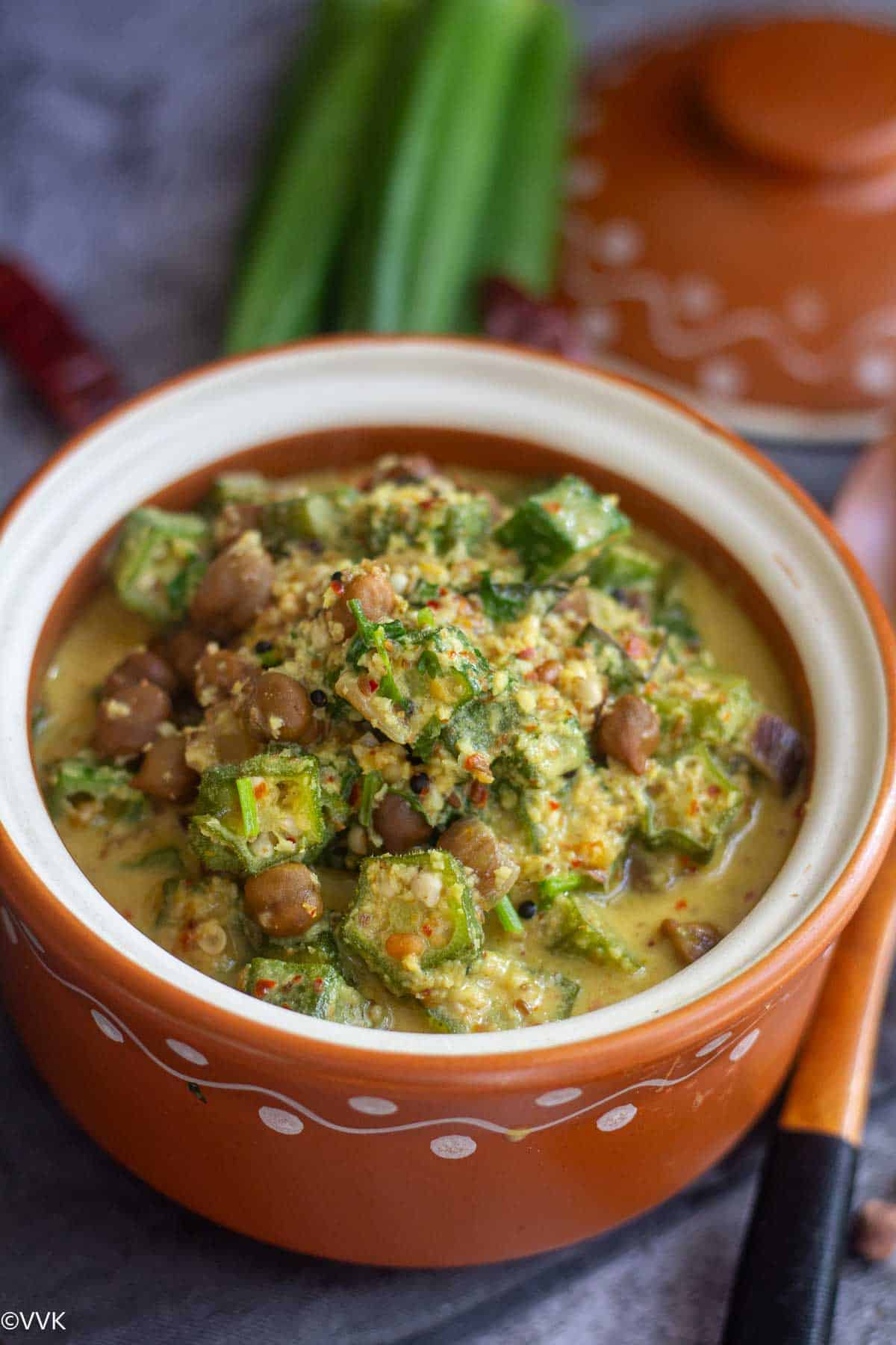 close up shot of vendakkai kootu in terracotta bowl