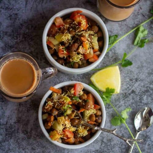square image of black chickpeas salad served with tea