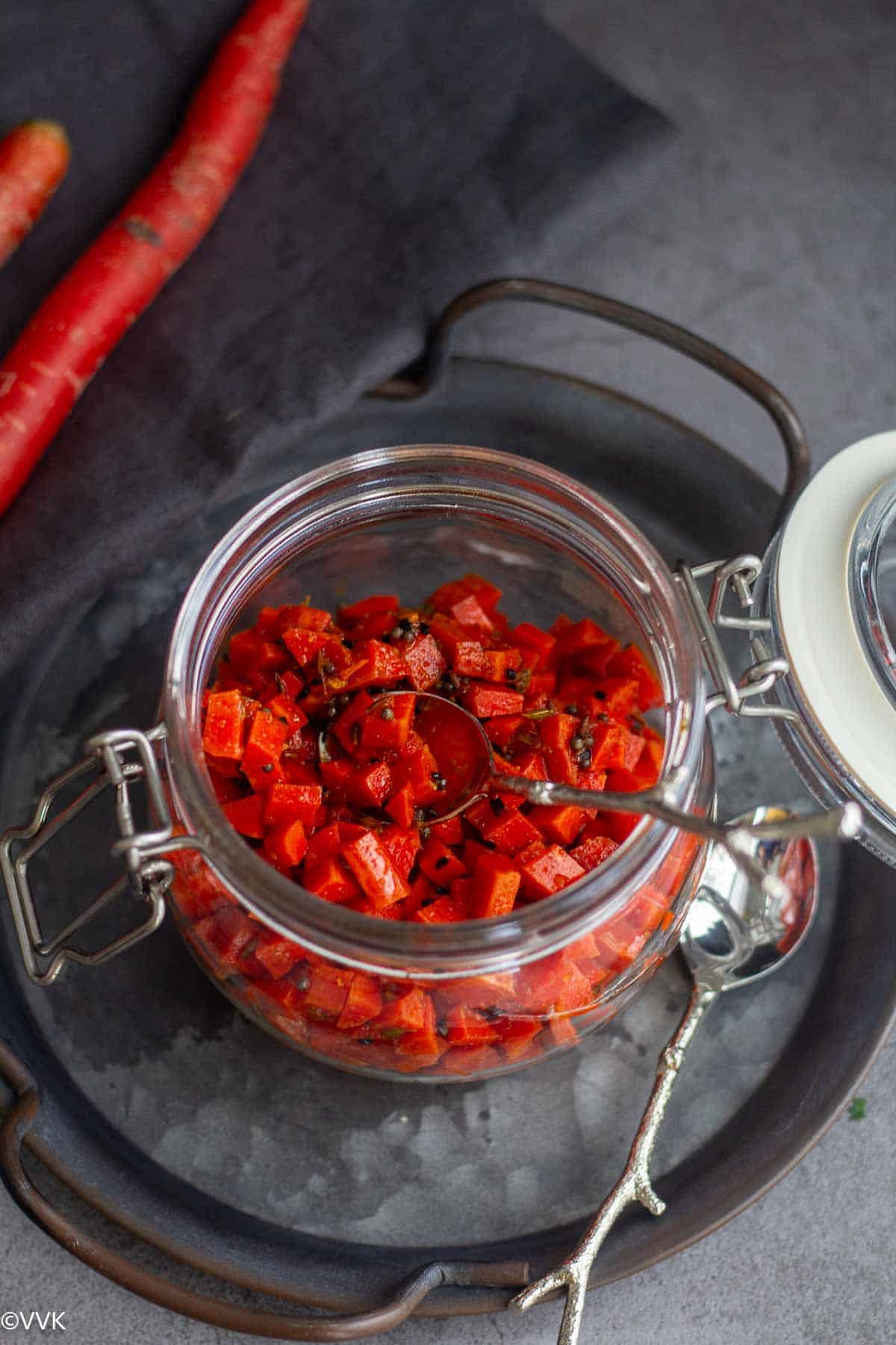 Prepared carrot pickle in a glass jar
