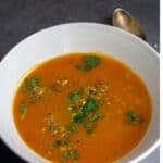carrot ginger soup with text overlay for pinterest