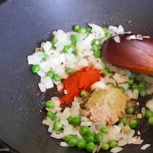 adding peas and dry masala