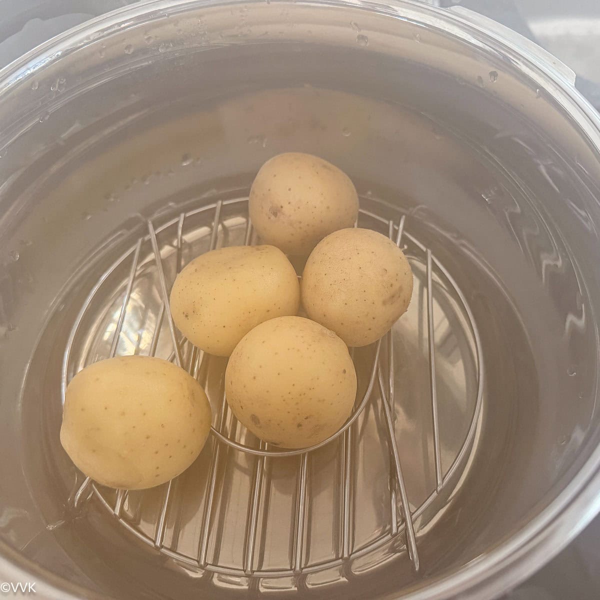 pressure cooking the potatoes for the tots