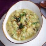 square image of chayote kootu served in ceramic serveware