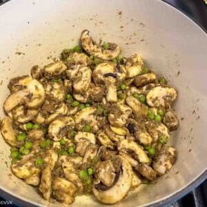 adding mushrooms and peas