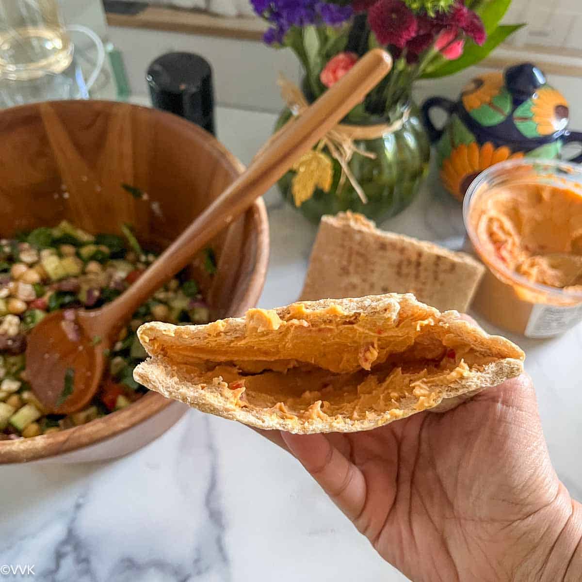 pita smeared with hummus