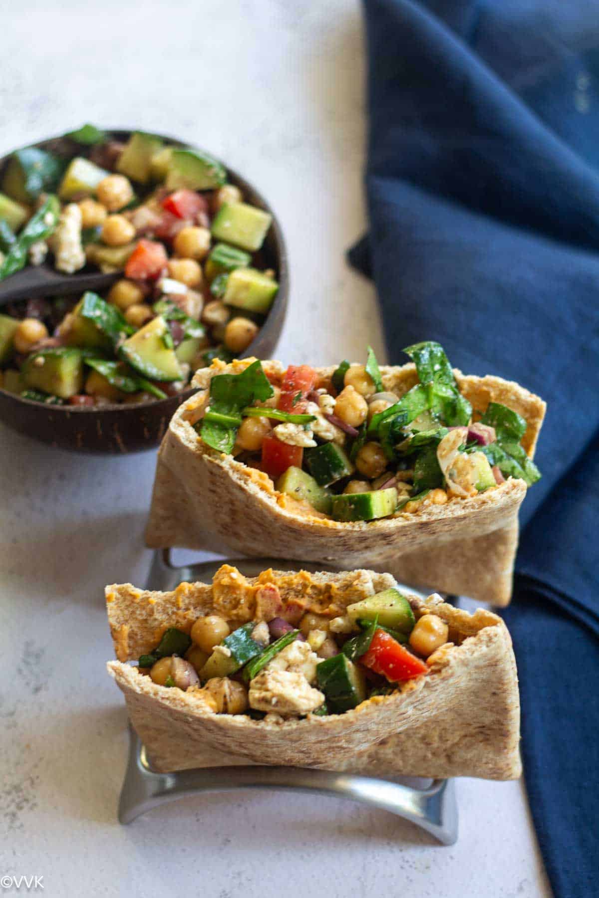 two pita pockets filled with the prepared salad