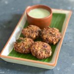 square image of vazhai poo vadai served in plate lined with banana flower