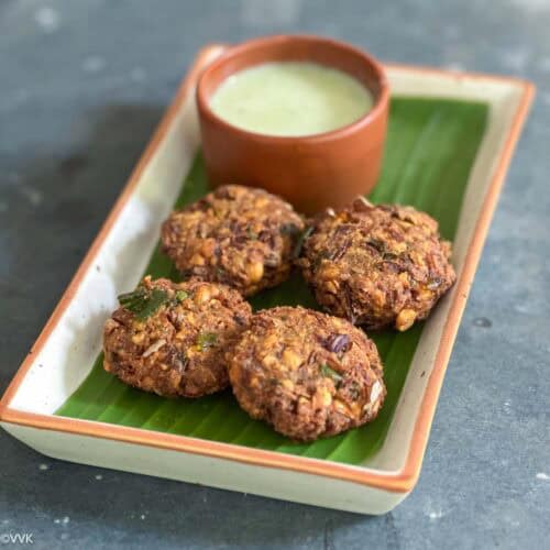 square image of vazhai poo vadai served in plate lined with banana flower