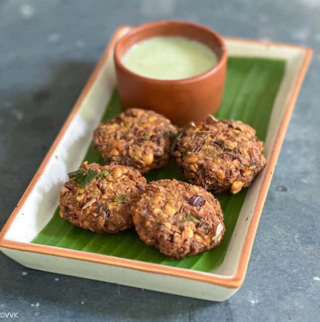 square image of vazhai poo vadai served in plate lined with banana flower