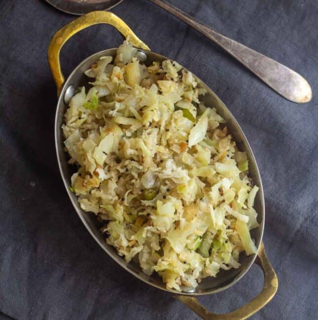 square image of cabbage poriyal served in rectangular tray